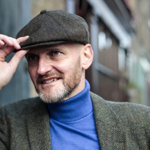 Gentleman walking in a street - Man wearing vintage clothes - Bald man wearing a retro hat